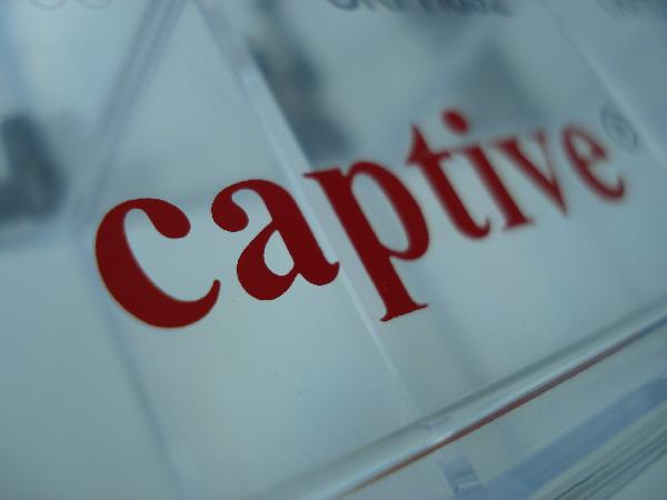 The Word Captive on a glass wall